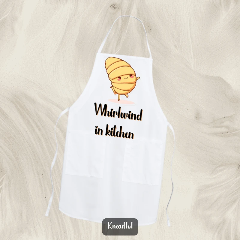 Funny apron with a cheerful croissant chef character doing a playful cartwheel with small feet, perfect for humorous baking.
