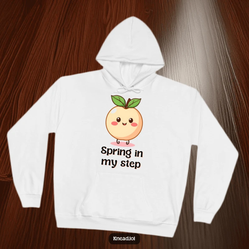 Funny Peach Bounce Hoodie featuring a round, happy peach bouncing with delight, offering warm and humorous comfort.